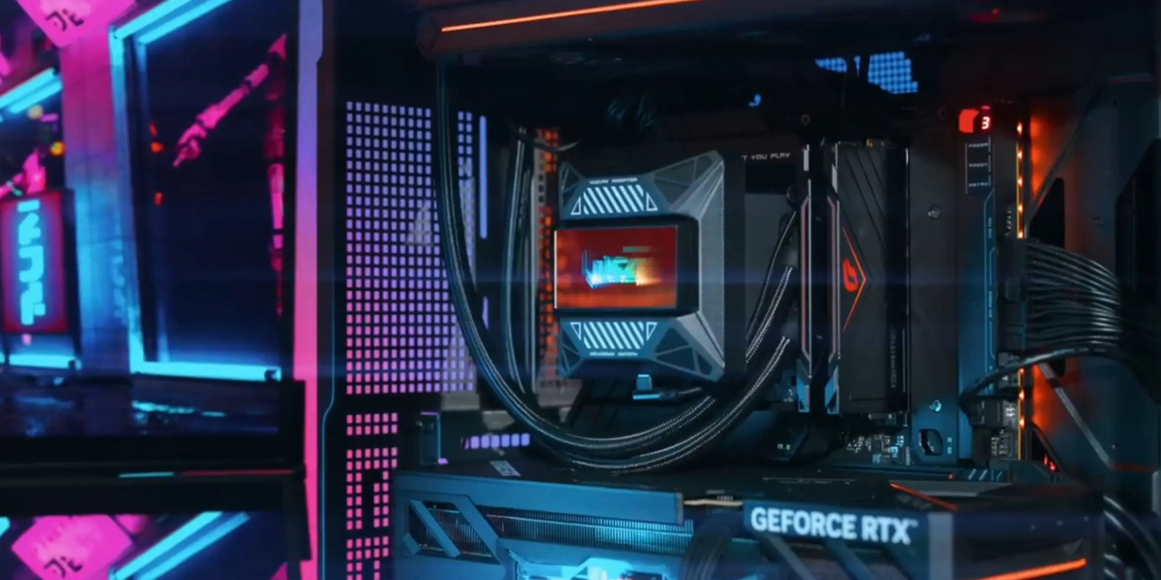 Colorful iGame Vulcan : PC Gamer avec écran détachable sur la GPU et AIO LCD 27 Boîtier Colorful iGame Vulcan PC montrant la carte graphique avec écran détachable et un nouveau watercooling RGB, vue de tro