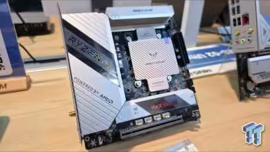 Carte mère Mini-ITX avec logo Ryzen et détails vifs, fond bois clair