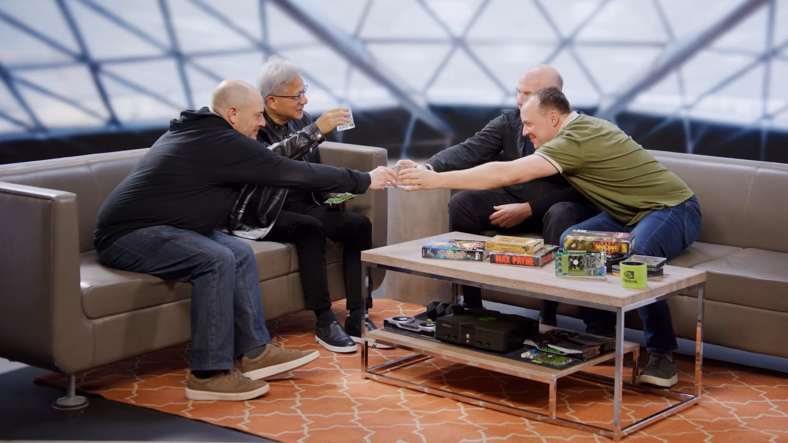 Groupe de personnes discutant autour de cartes graphiques NVIDIA, environnement lumineux