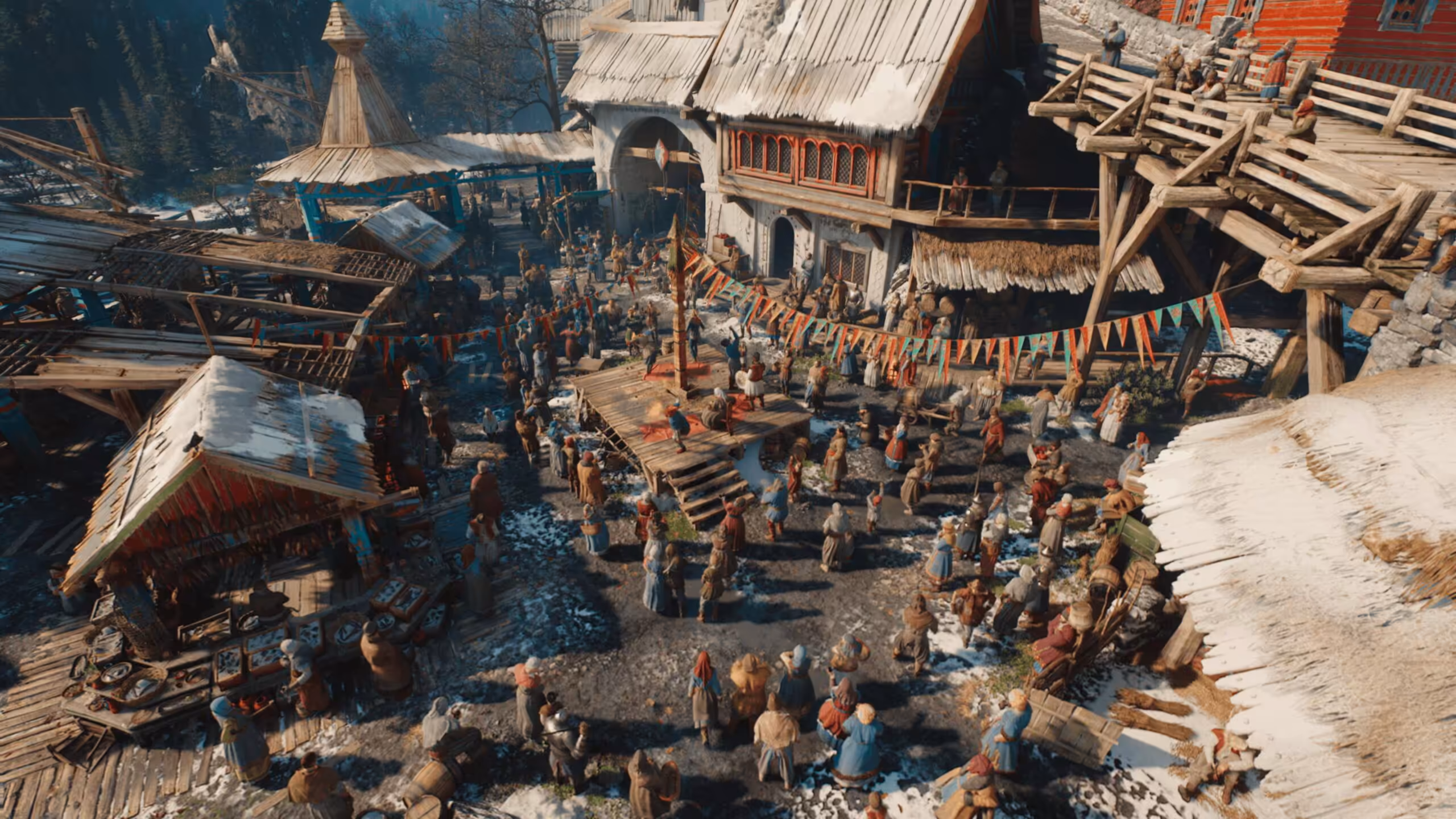 Vue aérienne d'un village avec de nombreux personnages et bâtiments couverts de neige.