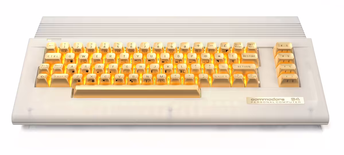 Clavier Commodore C64C transparent avec touches dorées, design rétro-futuriste.