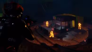 Joueur en vue troisième personne observant un bâtiment éclairé, ennemis lumineux orange autour de la structure