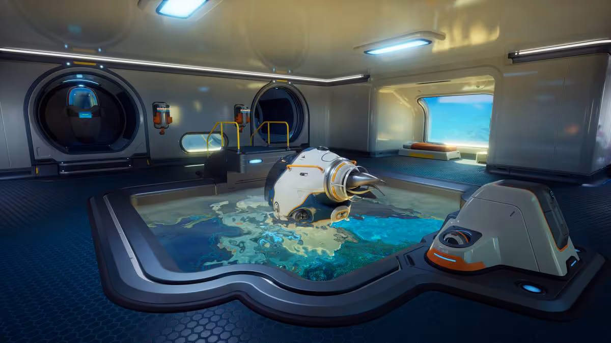 Subnautica 2 fixe sa sortie en accès anticipé au 14 mai 2026 sur PC et Xbox 3 Intérieur d'une base sous-marine futuriste avec petit véhicule aquatique dans Subnautica 2.