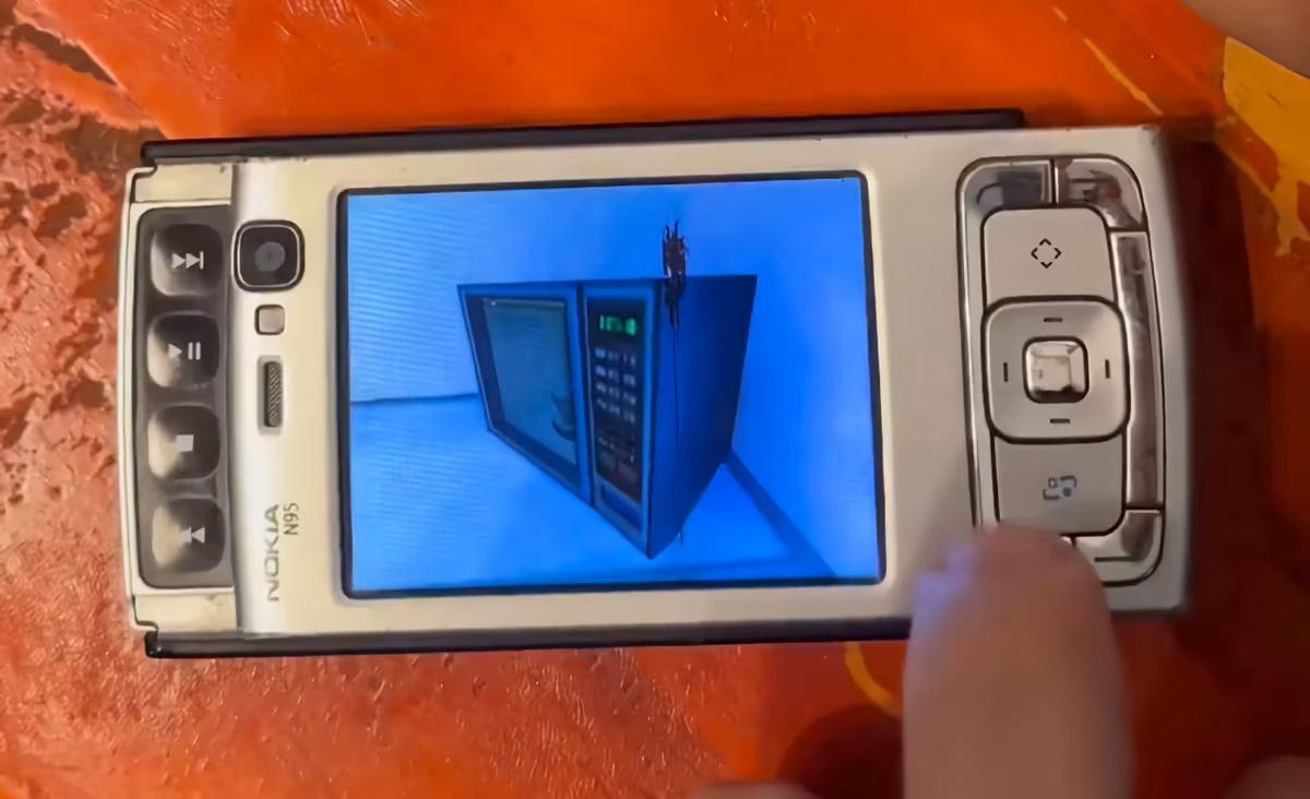 Nokia N95 affichant Half-Life 1, vue écran ultra-rapprochée, fond orange