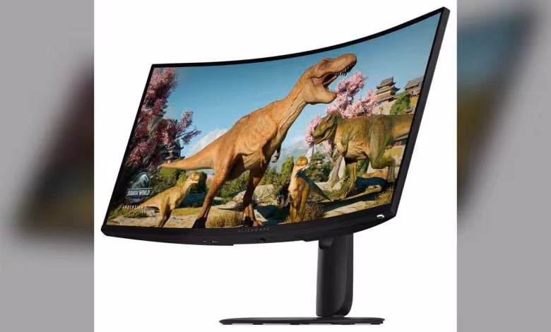 Alienware 30 ans : quatre moniteurs gaming dévoilés à la Computex 2026, dont un OLED 5K 39 pouces 1 Moniteur gaming Alienware incurvé avec image de dinosaures, dalle ultra-large et pied central noir.