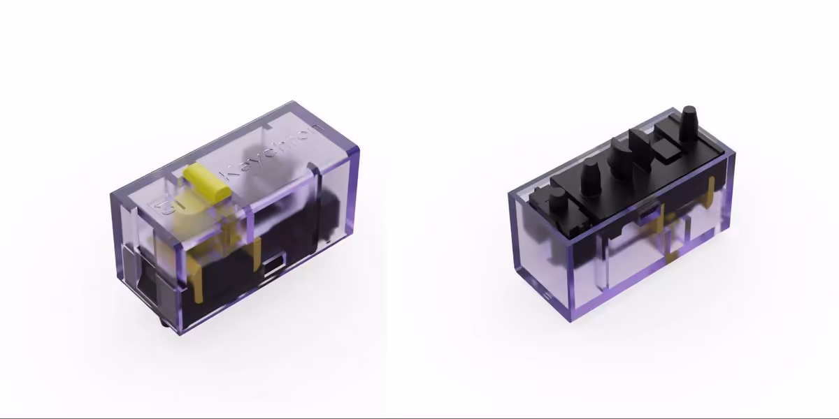 Deux switchs mécaniques Keychron transparents violets montrant l’intérieur et les contacts, sur fond blanc