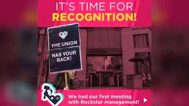 Affiche syndicale rose devant le siège de Rockstar, avec pancarte « The union has your back »