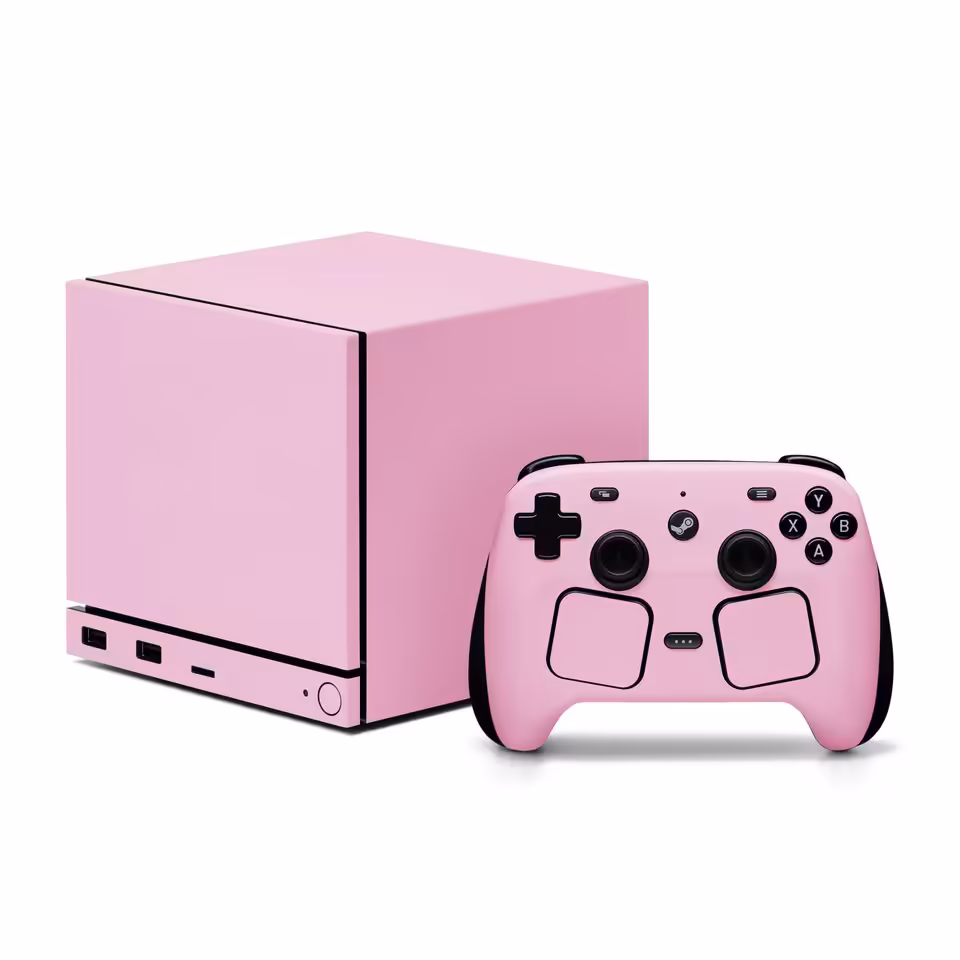 Steam Machine rose pastel avec manette assortie, habillage Dbrand minimaliste sur fond blanc