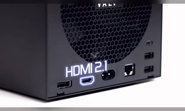 Photo d'un boîtier avec logo HDMI 2.1 éclairé sur fond noir intense