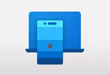 iPhone Apple devant un ordinateur portable bleu, illustration du presse-papiers universel entre iOS et Windows