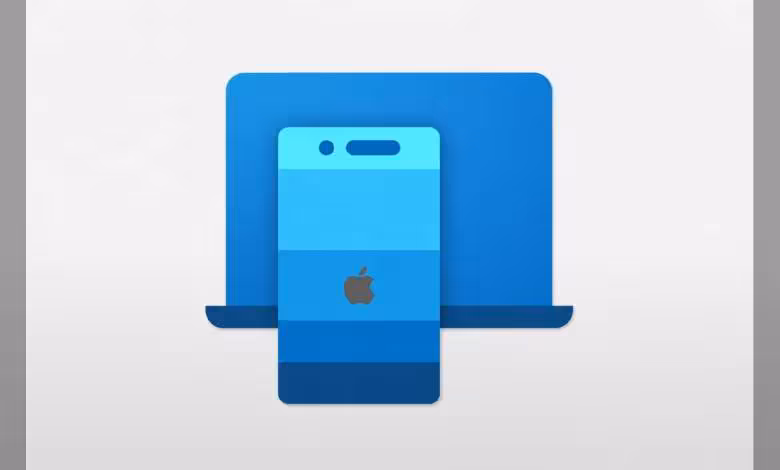 Presse-papiers universel Apple sur Windows : l’UE impose une arrivée prévue d’ici 2028 1 iPhone Apple devant un ordinateur portable bleu, illustration du presse-papiers universel entre iOS et Windows
