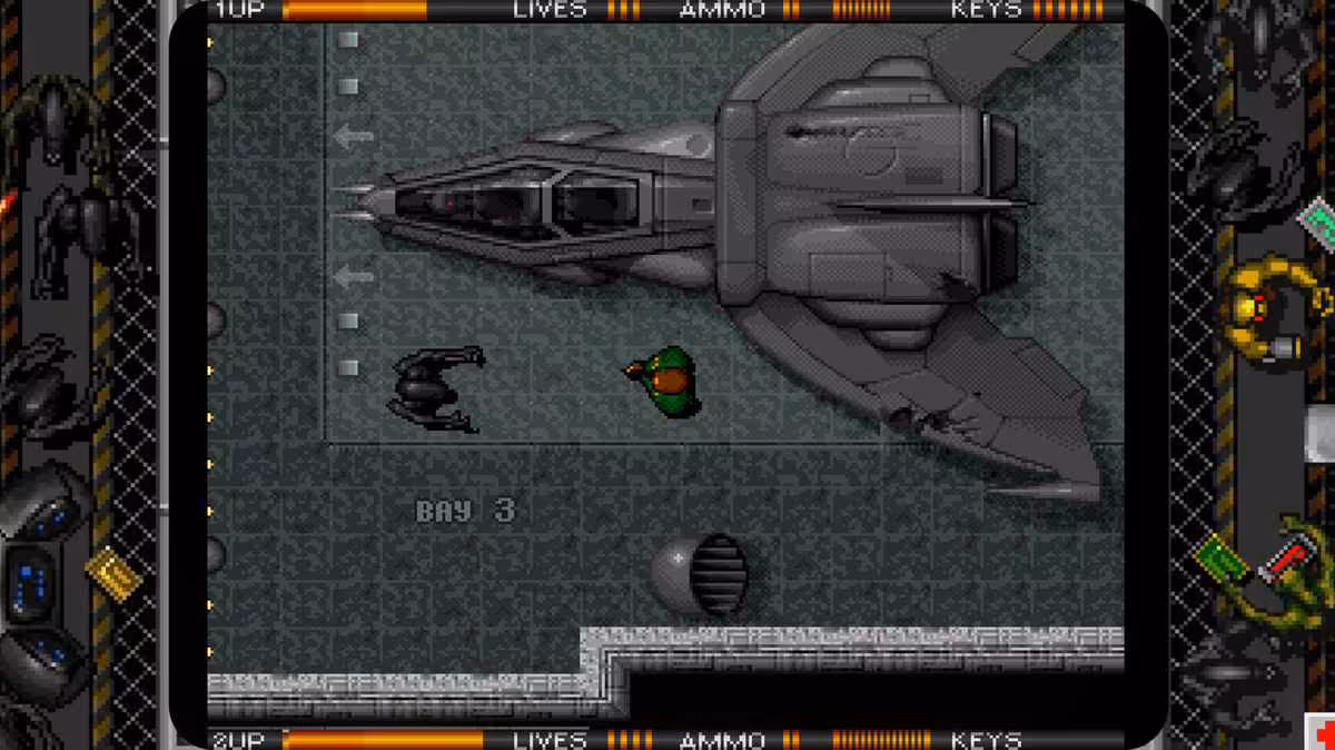 Capture de gameplay Alien Breed en vue aérienne avec vaisseau spatial et ennemis aliens