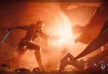Scène de combat de The Witcher Remake, Geralt en silhouette dans une grotte rougeoyante, explosion lumineuse brute