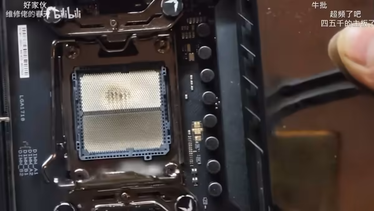 Ryzen 7 7800X3D seated in AM5 socket with visible burn marks on the CPU contacts