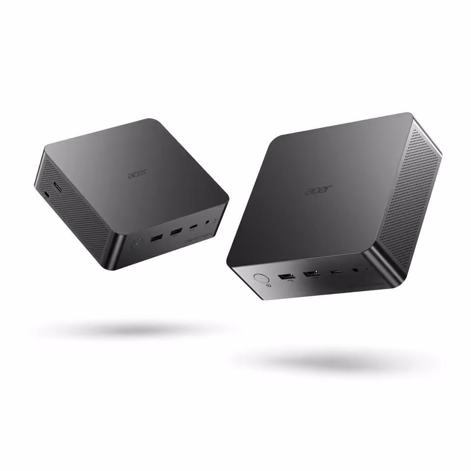 Deux mini-PC Acer noirs compacts, vus en angle, avec ports USB et design minimaliste