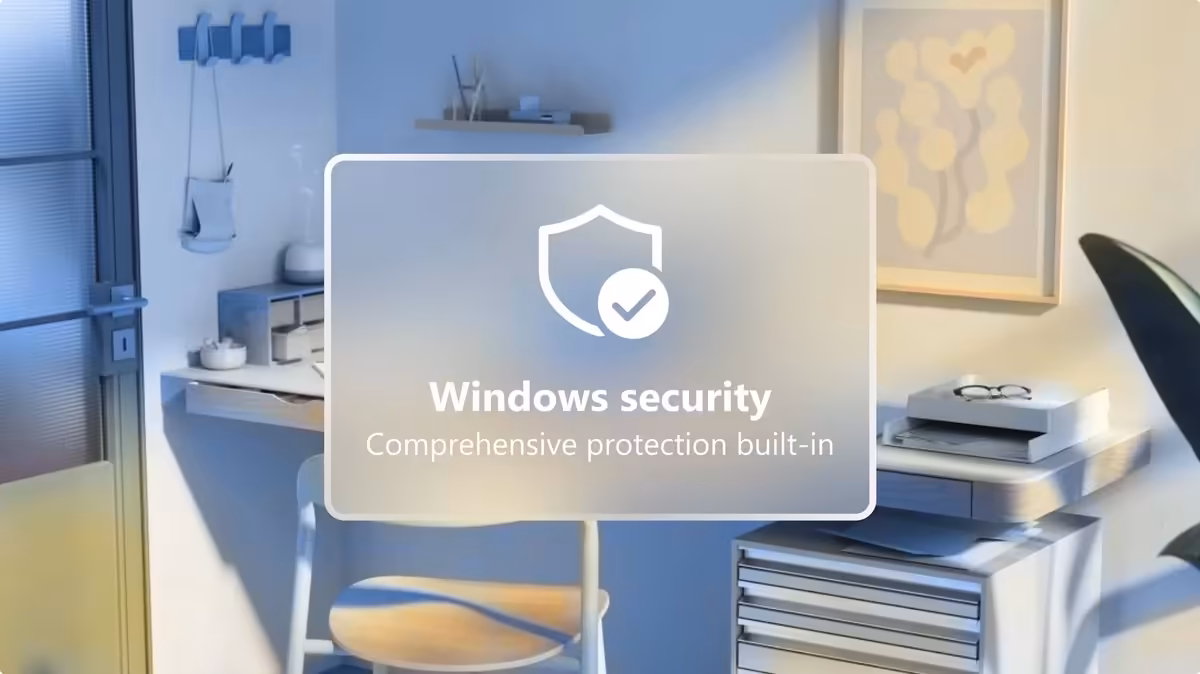 Bureau avec overlay Windows Security, icône bouclier et texte Comprehensive protection built-in