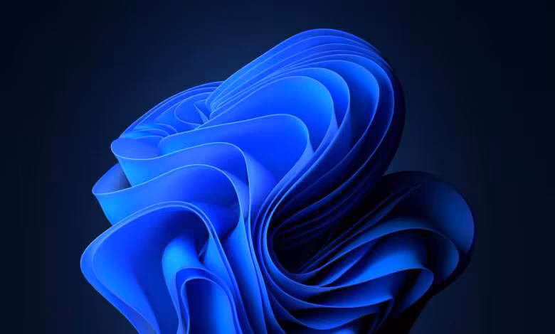 Windows 11 : le mode sombre arrive dans Hyper-V, mais reste largement inachevé 1 Fond d’écran abstrait bleu emblématique de Windows 11 sur arrière-plan sombre## +#+#+#+#+#+