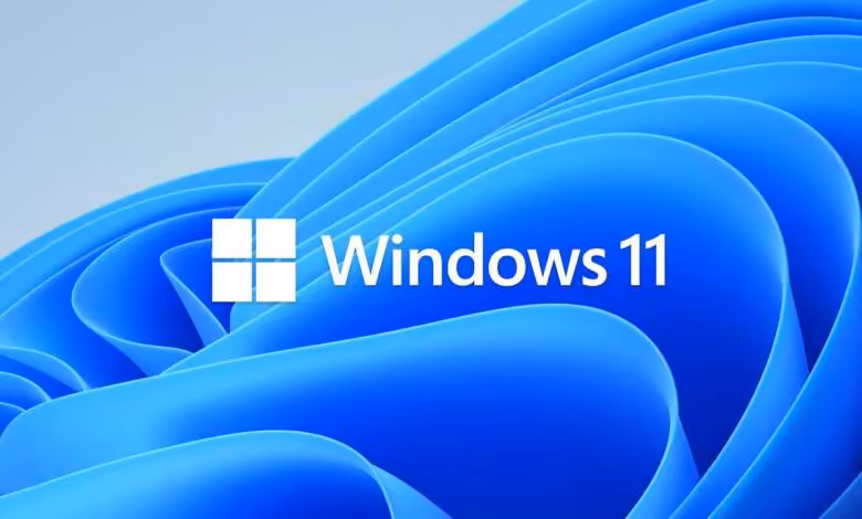 Windows 11 dépasse le milliard d’utilisateurs, cinq ans après son lancement 1 Logo Windows 11 blanc sur fond bleu abstrait caractéristique du système d’exploitation Microsoft